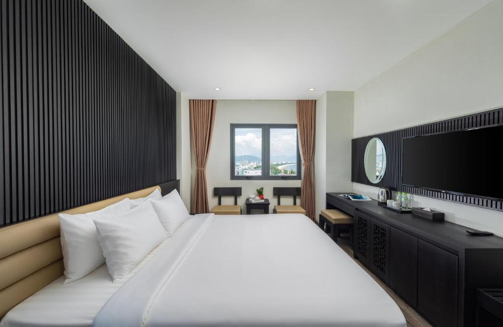 Giường trong phòng chung tại Ocean Star Da Nang Bay Hotel