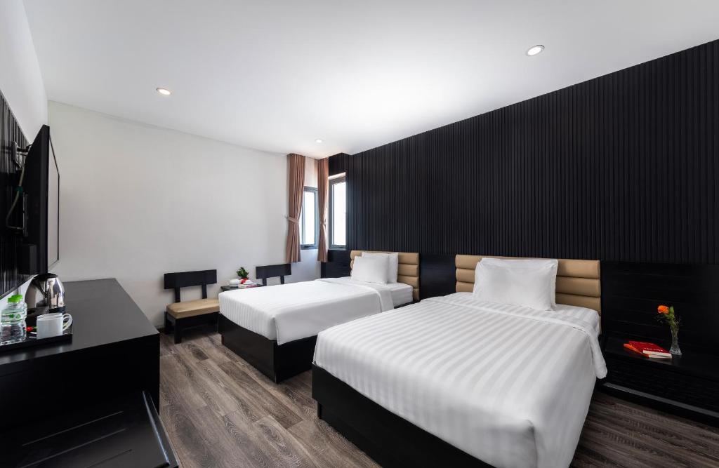 Giường trong phòng chung tại Ocean Star Da Nang Bay Hotel