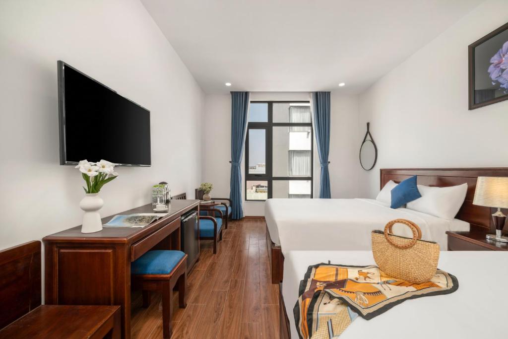 TV/trung tâm giải trí tại Sea Near Me Hotel Danang